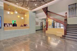 a man standing in the lobby of a building at ibis Styles Kingsgate Melbourne in Melbourne