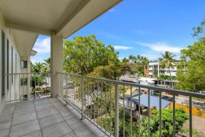 a balcony with a view of the water at The Marron Bloom - Beachfront Boutique Bliss in Palm Cove