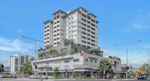 a tall white building with plants on the top of it at 'The Sand Dollar' Central Cairns Chic with Adjacent Studio in Cairns