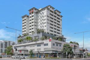 a large white building with plants on top of it at 'Seaside Azul' A Central Studio with Rooftop Pool in Cairns