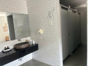 a bathroom with a sink and a mirror at Lemon House in Quy Nhon