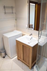 a bathroom with a toilet and a sink at Modern Apartment in Tartu