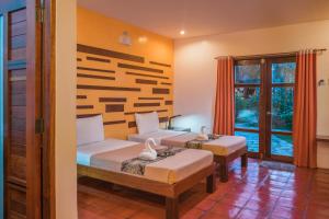 Posteľ alebo postele v izbe v ubytovaní Acacia Tree Garden Hotel