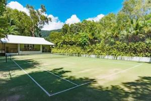 an image of a tennis court at Couple's Coastal Haven Retreat at The Beach Club in Palm Cove