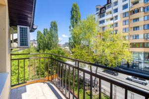 a balcony with a view of a street at Обійми Embrace in Truskavets