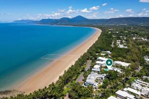 an aerial view of a beach next to the ocean at Mira - Poolside Beach Retreat by Four Mile Beach in Port Douglas
