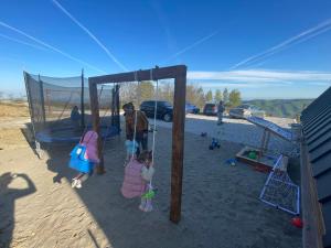a group of children playing in a playground at Cabana AxD in Cotorăşti +18 photos