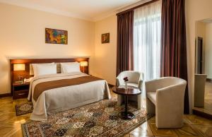 Voodi või voodid majutusasutuse Arève Résidence Boutique Hotel toas