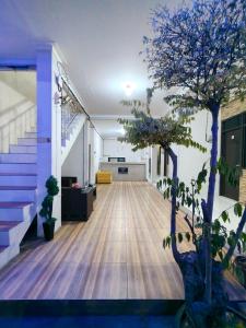 an office with a hallway with trees and stairs at Baga Guesthouse in Kanggraksan