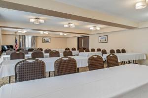 a conference room with white tables and chairs at Comfort Inn Manistique in Manistique