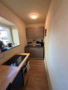 a small kitchen with a sink and a stove at Himmelswege in Nebra