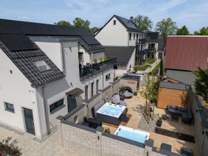 an aerial view of a house with a swimming pool at Haus Lindolino in Elsterheide