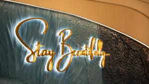 a sign on the side of a car in the rain at The Malibu Hotel in Vung Tau