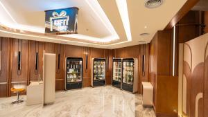 a row of soda machines in a room at The Malibu Hotel in Vung Tau