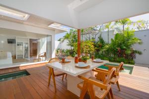 a dining room with a table and chairs at Villa Lior - 1BR Luxury Hideaway near Nyanyi Beach in Canggu