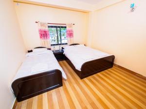 Katil atau katil-katil dalam bilik di Hotel Sunflower