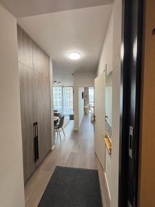 a hallway leading to a living room with a table at Parkr Land Elite in Uzhhorod +6 photos