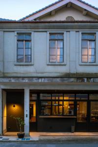 a building with a lot of windows at Lhotel de Mai in Tamba-sasayama