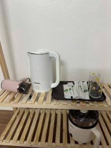a coffee maker sitting on top of a shelf at Lapausa Homestay in Kỳ Vĩ