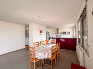 a kitchen and dining room with a table and chairs at Appartement Lily-rose in Cerizay