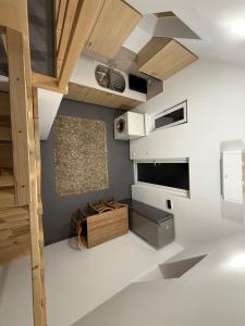 a room with a white floor and wooden ceilings at Apartament in Chişinău