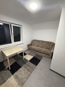 a living room with a couch and a table at Apartament in Chişinău