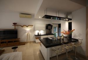 a kitchen with a black counter top in a room at Luxury 4BR New Cairo Villa with Pool & Stylish Living - FAMILY ONLY in Cairo