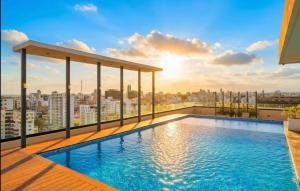 a swimming pool on the roof of a building at Torre meridt in Santo Domingo