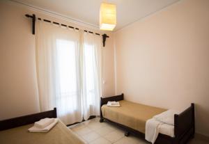 Postel nebo postele na pokoji v ubytování Annaliza Apartments