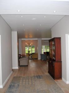a large room with a living room with a large room with at Mount Edgecombe Estate Lodge in Mount Edgecombe +37 photos