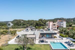 an aerial view of a house with a swimming pool at Casadi Luxury Villa in Ialysos