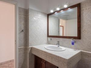 a bathroom with a sink and a mirror at Angel Serenity Villa in Kampos Paros +33 photos