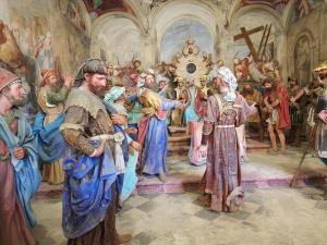 a painting of a group of people in a church at Villa Coccodrilla Varallese in Varallo