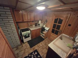 an overhead view of a kitchen with a stove top oven at Chata Bambi, Tatranská Štrba pri zubačke in Štrba