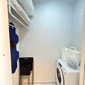 a laundry room with a washer and a washing machine at Cool Downtown Apartment in Burgas