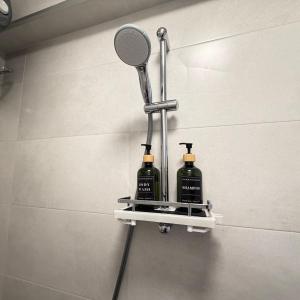 a mirror and two bottles on a shelf in a bathroom at Cool Downtown Apartment in Burgas +14 photos