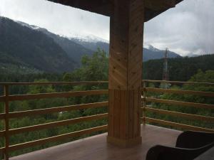 a room with a view of the mountains at Nirvana Stays and Cafe in Manāli