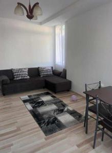 a living room with a couch and a table at LaScena in Techirghiol