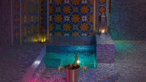 a small pool of water with a candle in it at AjoieSpa in Porrentruy