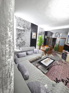 a living room with a couch and a table at Villa Kena in Ksamil