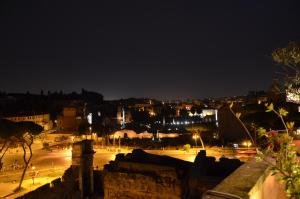 a view of a city at night at Residenza Maritti Decò Style in Rome