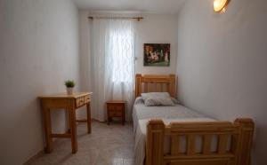 Postel nebo postele na pokoji v ubytování Hostal Sango Sierra de las Nieves