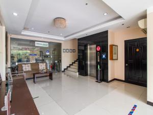 a lobby of a store with a waiting room at Main Hotel and Suites Cebu in Cebu City
