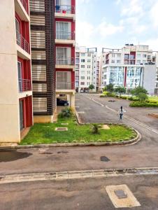 an empty street in a city with tall buildings at kijani retreat in Nairobi +1 photo