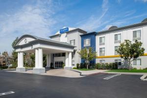 a hotel with a gazebo in a parking lot at City Express By Marriott Rancho Cucamonga in Rancho Cucamonga