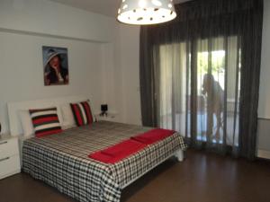 Кровать или кровати в номере Violeta Apartments