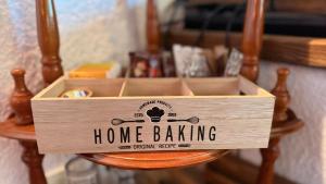 a wooden home baking box sitting on a table at Villa Di Mare in Mesimvría