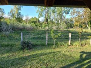 a fence in the middle of a field at Vasin Šib in Crna Bara +1 photo
