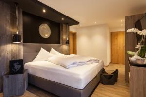 Postel nebo postele na pokoji v ubytování Hotel Möderle