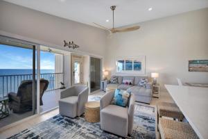a living room with a view of the ocean at Captiva Hide A Way 2B in Captiva